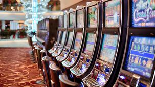 row of electronic gaming machines in a venue